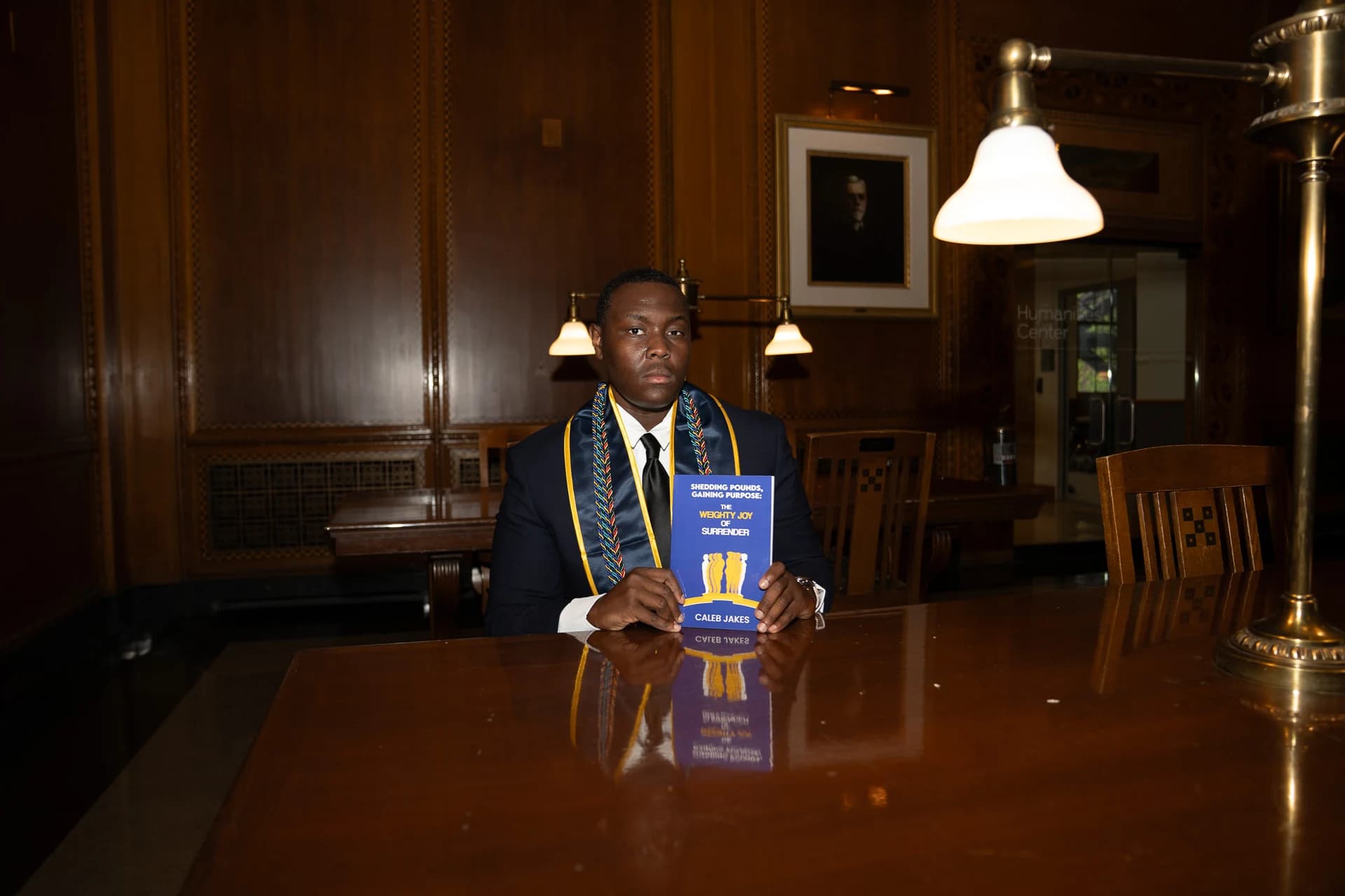Caleb Jakes with his book