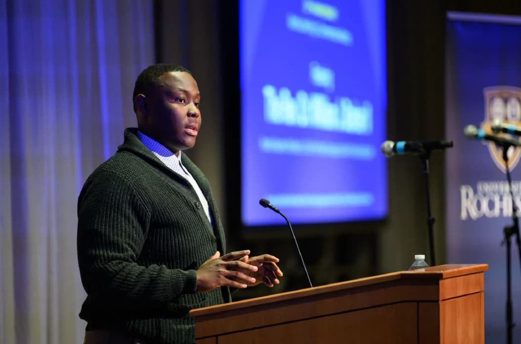 Caleb Jakes speaking with a microphone